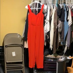 NEVER WORN red jumpsuit from H & M. Euro size 38.